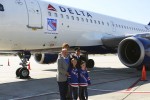 Rod Gilbert, Ron Duguay pose in front of the plane with the captain and some young fans. (Photo by Matt Molnar/NYCAviation)
