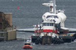 Enterprise scrapes its way through the narrow bridge structure. (Photo by Vinny Ohare)