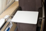 First Class seat with tray table. (Photo by Eric Dunetz/NYCAviation)