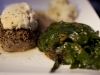 Beef fillet crusted in Boursin cheese served with wilted spinach on top of balsamic grilled tomatoes with whipped potatoes.