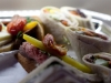 Finger sandwiches adorn the self service premium cabin bar.