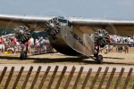 A Ford Tri-Motor stops briefly to pick up passengers on another revenue flight.