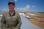 C-5 Galaxy Adam Weiss poses atop the tail of a C-5 Galaxy based out of Travis AFB (CA) with an expansive view of the AirVenture ramp.