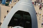 Visitors to AirVenture 2012 fill the main thoroughfare as the giant mouth of the C-5 Galaxy threatens to consume them all.
