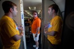 Brooks Thomas, communications employee with Southwest Airlines, welcomes a visitor on board the newly revamped 737-700.