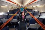 A family tours the new Evolve interior of the Southwest 737-700 at AirVenture 2012.