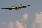 Ghost Squadron C-46 Commando Tinker Bell skims the clouds during a demo of WWII transport aircraft.