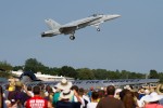 The F/A 18 performs a go-around in front of the crowd.