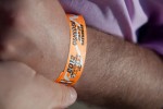 NYCA editor-in-chief Matt Molnar affixes his 2012 Oshkosh AirVenture admission band to his wrist.