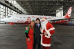 Santa Claus and his helpers pose in front of the Air Berlin Santa Claus Tour 2012 Boeing 737 (D-ABMJ). (Photo by Air Berlin)