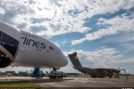 Two of the world’s latest widebody aircraft together at Farnborough Airport: Airbus Military’s A400M military airlifter joins the A380 of Malaysia Airlines in the air show’s static display area. (Photo by Airbus)