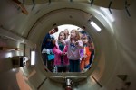 Former NASA shuttle astronauts Wendy Lawrence (L) and Nicholas Patrick (R) show Julianna (8) & Emily Heiland (11) the airlock of the shuttle trainer. (Photo by Jeremy Dwyer-Lindgren/NYCAviation)