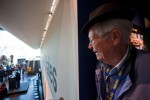 Llloyd Yates, 86, a volunteer at the Museum of Flight, peers around the entrance to the payload bay to get a lok at the growing crowd before speakers assemble. (Photo by Jeremy Dwyer-Lindgren/NYCAviation)
