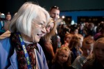 Barbara Yates, 81, a Museum of Flight volunteer, talks with children in the front rows before the trainer opens to the public. (Photo by Jeremy Dwyer-Lindgren/NYCAviation)