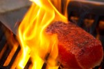 A salmon filet cooks on the grill. (Photo by Jeremy Dwyer-Lindgren/NYCAviation)
