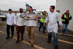 From left to right: Executive chef Pat Donahue, of Anthony's Restaurants; executive chef Wayne Johnson of Ray's Boathouse, Frankie Ragusa of Ocean Beauty Seafoods, and executive chef Jason Wilson of Crush, walk with a 55 pound Copper River King Salmon after the first delivery. (Photo by Jeremy Dwyer-Lindgren/NYCAviation)