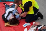 A rescuer treats a victim.