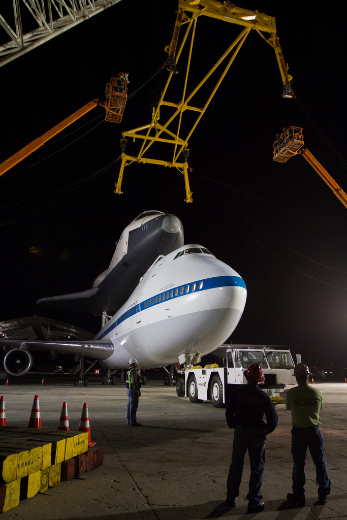 A yellow sling is lowered onto Space Shuttle Enterprise. (Photo by NASA/Kim Shiflet)