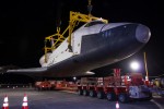 The Space Shuttle Enterprise is lowered onto a transport vehicle after being demated from the NASA 747 Shuttle Carrier Aircraft. (Photo by NASA/Kim Shiflet)