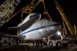 NASA and United Space Alliance workers lower a yellow sling onto space shuttle Enterprise, which sits atop NASA's 747 Shuttle Carrier Aircraft (SCA) prior to it being demated a few hours later.(Photo by NASA/Kim Shiflet)