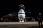 NASA's 747 Shuttle Carrier Aircraft (SCA), with space shuttle Enterprise latched on its back, is towed from the hangar at John F. Kennedy (JFK) International Airport in New York late in the night. (Photo by NASA/Kim Shiflet)