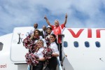 Sir Richard Branson cheers with some flight attendant/cheerleaders. (Photo by Manny Gonzalez/NYCAviation)