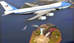 A VC-25 passes over the Statue of Liberty during a controversial photo shoot.