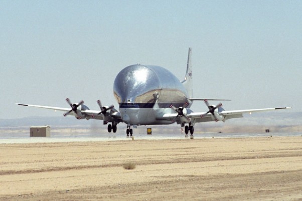 NASA's B377SGT Super Guppy Turbine cargo aircraft touches down at Edwards Air Force Base, Calif. on June 11, 2000 to deliver the latest version of the X-38 flight test vehicle to NASA's Dryden Flight Research Center. (Photo by NASA)