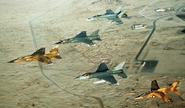 Coalition aircraft in formation over Saudi Arabia during Operation Desert Shield. From left to right: Qatari F-1 Mirage, French F-1C Mirage, US Air Force F-16C Fighting Falcon, Canadian CF/A-18A Hornet and Qatari Alpha Jet. (Photo by US Air Force/Staff Sgt. Lee Corkran)