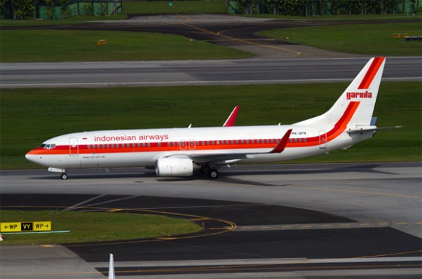 The retro liveried Garuda Indonesian Airways Boeing 737-800 PK-GFM taxis at Singapore