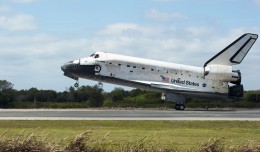 Space Shuttle Discovery touches down on Runway 15 at the Shuttle Landing Facility at NASA's Kennedy Space Center in Florida, concluding its 39th and final mission