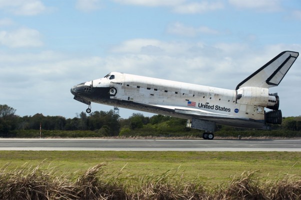 Space Shuttle Discovery touches down on Runway 15 at the Shuttle Landing Facility at NASA's Kennedy Space Center in Florida, concluding its 39th and final mission