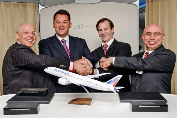 Boeing and Transaero executives celebrate the deal aboard the 787 Dream Tour plane over Russia. From left: Alexander Krinichansky, Transaero Airlines executive director; Alexander Pleshakov, Transaero Airlines chairman of the board; Marty Bentrott, vice president of Sales for Middle East, Russia and Central Asia, Boeing Commercial Airplanes; Serdar Gurz, director international Sales, Boeing Commercial Airplanes. (Photo by Boeing)