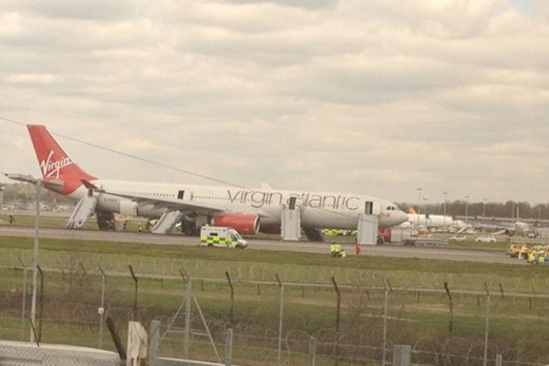 Virgin Atlantic Flight 72, an Airbus A330-300 (G-VSXY) sits on the runway at Gatwick with its emergency slides deployed. (Photo by Lorna Wilson via Twitter)