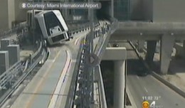 Surveillance video shows the people mover leaning to its side after losing a wheel. (Photo by Miami International Airport, via CBS Miami)
