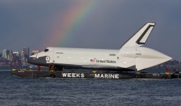 Enterprise meets a rainbow in New York Harbor. (Photo by Wavefront)
