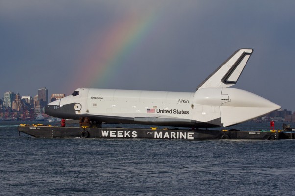 Enterprise meets a rainbow in New York Harbor. (Photo by Wavefront)
