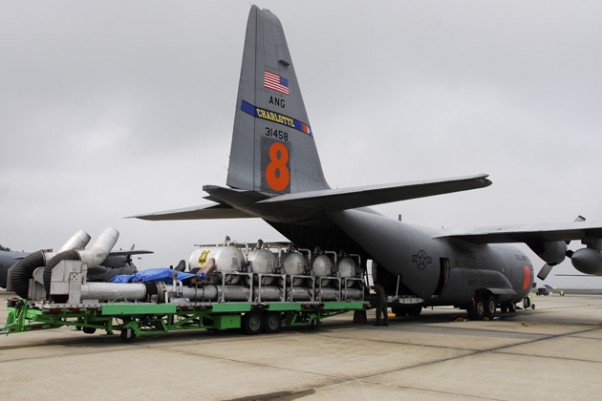 Modular Airborne FireFighting System (MAFFS) being loaded onto an Air Force C-130 Hercules. (Photo by US Air Force)