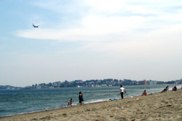 A Southwest Airlines jet on approach to Logan Airport passes over Revere Beach. (Photo by Sara Jeanne Edwards via Flickr, CC BY-NC-SA)