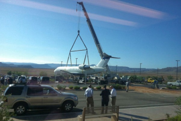 SkyWest Delta Connection CRJ being lifted out of a ditch by crane at St. George Airport in Utah. (Photo by KSL)