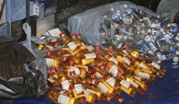 Thousands of the recovered bottles of liquor were displayed at a press conference held by Queens District Attorney Richard Brown. (Photo by Queens DA's Office)