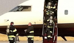 Mitt Romney campaign press secretary Andrea Saul tweeted this photo of firemen rushing onto the aircraft in Denver. (Photo via @andreamsaul)