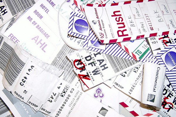 A collection of luggage tags. (Photo by Steve D. via Flickr, CC-BY-NC-SA)