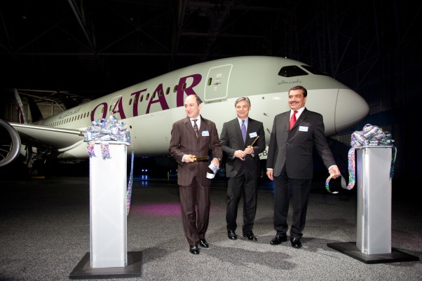 The first Qatar Airways Boeing 787 Dreamliner poses behind Boeing Commercial Airplanes CEO Ray Conner, Qatar Airways CEO Akbar Al Baker and Qatari Ambassador to the United States His Excellency Mohamed Bin Abdulla Al-Rumaihi. (Photo by Liem Bahneman/NYCAviation)