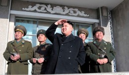 Kim Jong-un watches something in the sky. (Photo by Korean Central News Agency)