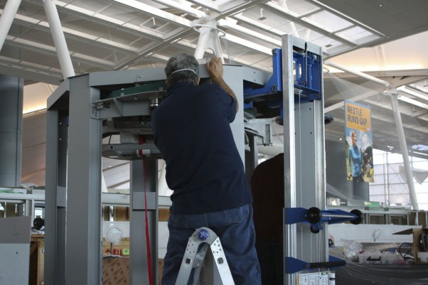 A technician assembles a brand new TSA body scanner. (Photo by Matt Molnar/NYCAviation)