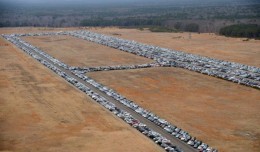 Tens of thousands of vehicles damaged by super storm Sandy are being temporarily stored on runways and taxiways at Calverton Executive Airpark in Calverton, New York, on January 9, 2013 in this aerial view. Insurance Auto Auctions Inc, a salvage auto auction company specializing in total-loss vehicles, acquired the cars and trucks and will put them up for auction. (Photo by Stan Honda/AFP)