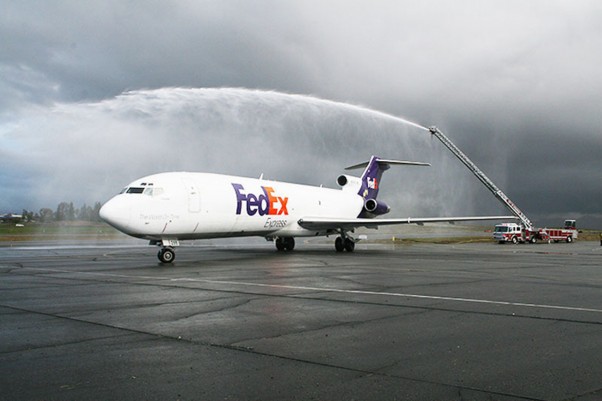 The Riverside Fire Department provides a water arch for the arrival of the Boeing 727-200 (N266FE) that FedEx Express donated to California Baptist University for the school's new aviation science program. The arch represented a symbolic salute on the conclusion of more than 32 years of commercial aviation service by the newly retired aircraft. (Photo by PRNewsFoto/California Baptist University, Kathie Chute)