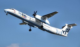 A Flybe Bombardier Dash-8-400 (G-JECL) takes off from Manchester Airport, England. (Photo by Arpingstone via wikimedia)