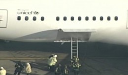 Smoke is seen in the rear cargo door of the Japan Airlines Boeing 787. (Screengrab from WHDH video)
